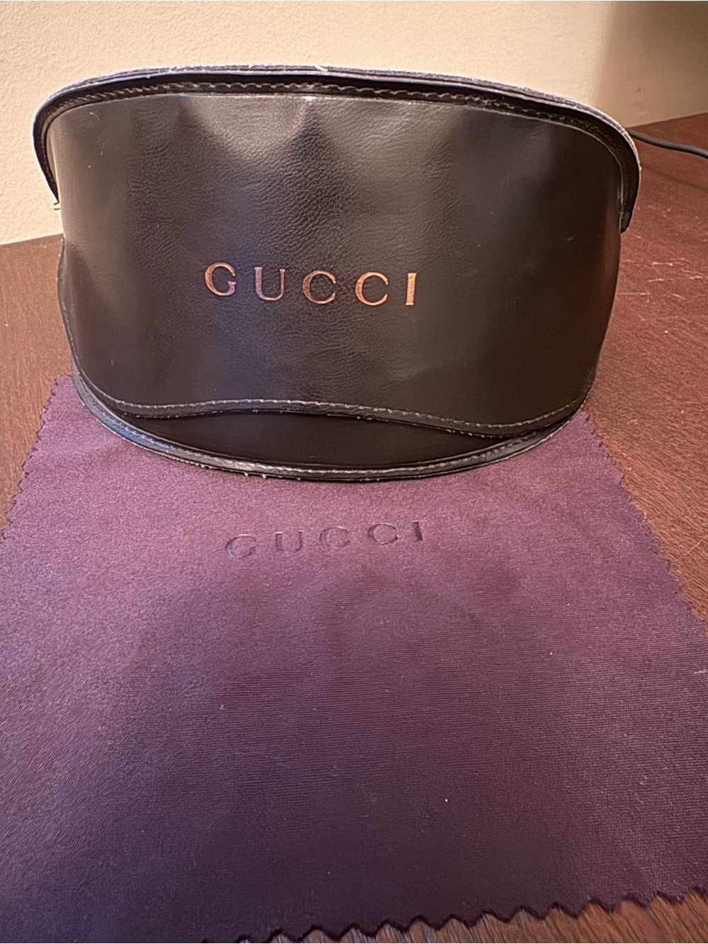 Gucci black leather sunglasses case and cleaning cloth